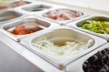 Food catering varieties background. Close up top side view, cooking using stainless steel dishware