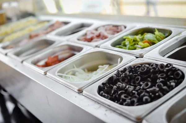 Food catering varieties background. Close up top side view, cooking using stainless steel dishware