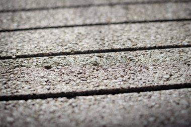 Hareket Bulanıklığı ambar geliştirme arka planda kazıklı görüntü çimento yapı taşları ticaret yığılmış. Kumaş tesisi closeup stoklarını üretimi, dokulu arka yüzeyi gri