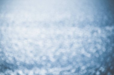 Abstract blurred ocean waves seascape, shiny bright natural outdoors textured background