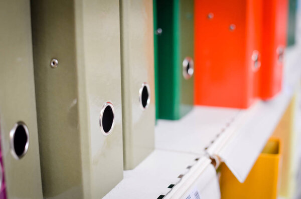 Closeup image of office shelves paperwork dossier binder background. Manage organization accountancy, financial bureaucracy, workplace guidelines, education university knowledge organizer