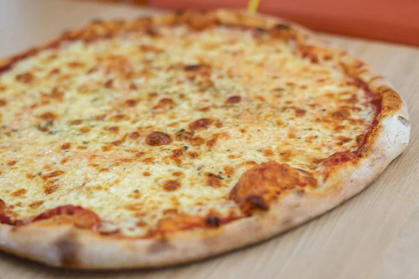 Pizza time on light wooden table background