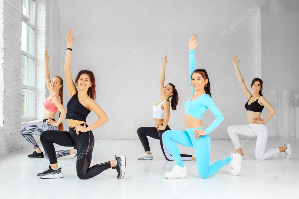 A group of girls dancing in the gym. The concept of sports, a he