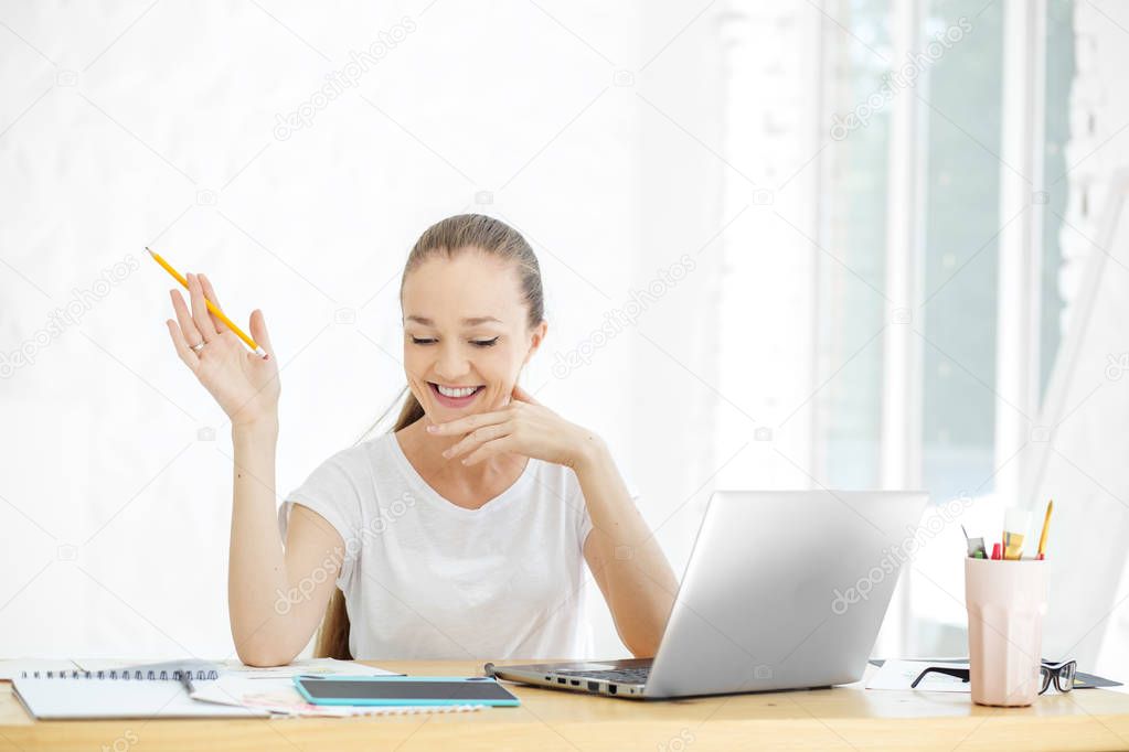 Successful happy woman works in the office. Concept for business, work, career.
