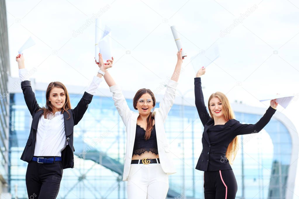 A business team rejoices in its success. Concept for business, employees, partners and entrepreneurs.
