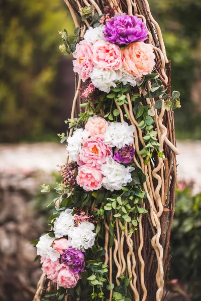 Wedding decorations with fresh pink and purple color flowers, close-up