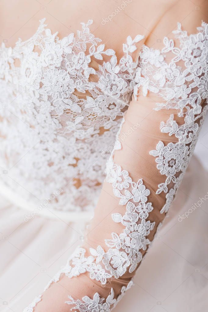 bride in lace white wedding dress, close-up