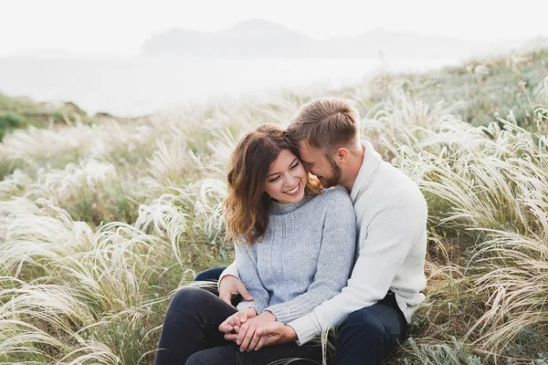 Happy Young Loving Couple Sitting Feather Grass Meadow Laughing Hugging — Stock Photo, Image