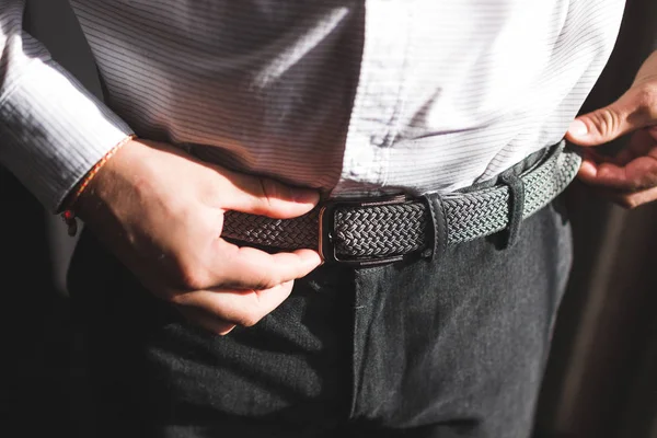 Man wearing belt. Classic style, getting ready of groom — Stock Photo, Image