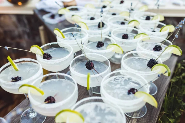 Set of Margarita cocktails with slice of lime and blackberry on — Stock Photo, Image