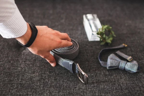 Man wearing belt. Classic style, getting ready of groom