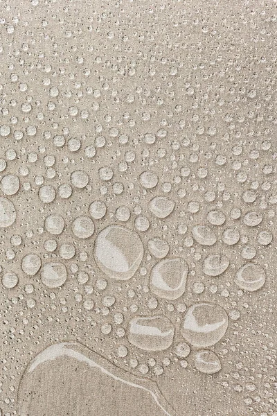 Texture des gouttes d'eau sur tissu textile gros plan. Rain backgrou — Photo