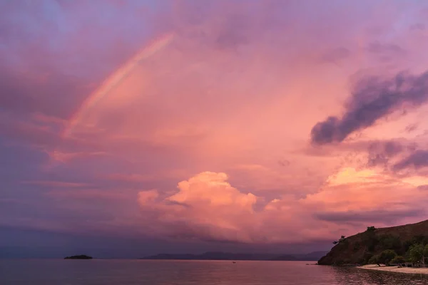 Amazing colorful sunset in pink living coral color with rainbow — Stock Photo, Image