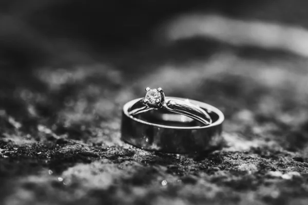 Close up of two wedding rings on the ground. — Stock Photo, Image