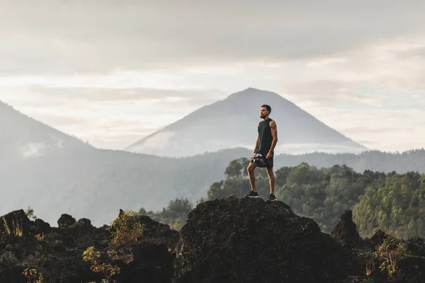Young Man Standing Top Stone Enjoying Amazing Volcanic Mountain Agung — Stock Photo, Image