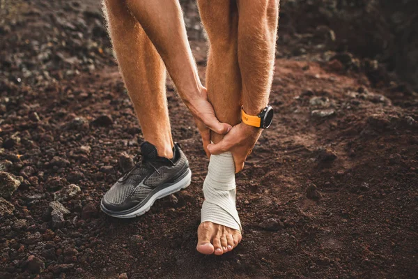 Male runner holding injured leg close-up and suffering with pain — Stock Image Male runner holding injured leg close-up and suffering with pain Stock Photo