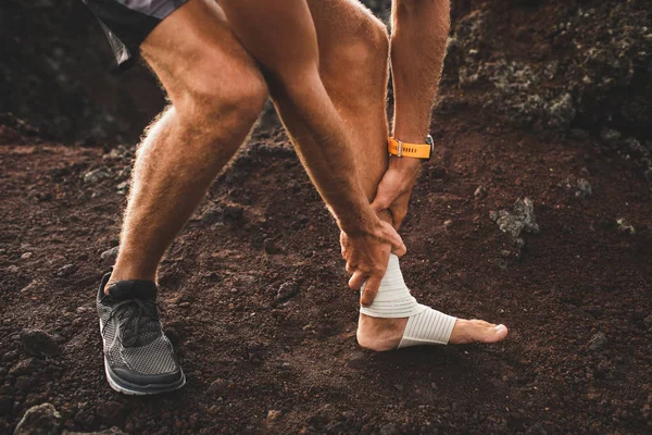 Male runner holding injured leg close-up and suffering with pain — Stock Image Male runner holding injured leg close-up and suffering with pain Royalty Free Stock Images