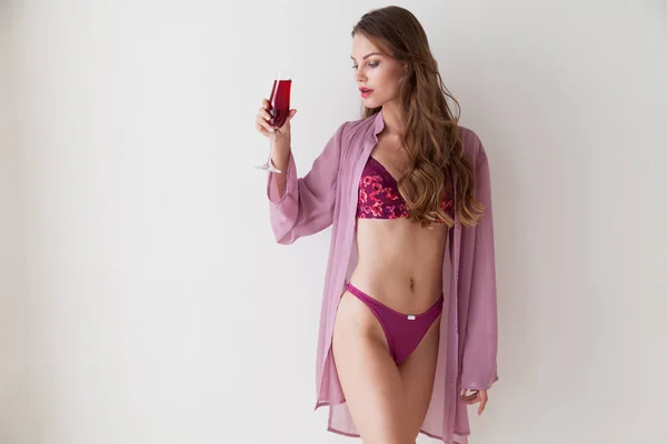 Beautiful woman in underwear with a glass of wine alcohol — Stock Photo, Image