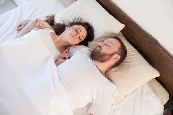 Husband and wife wake up in the morning in a bedroom love — Stock Photo, Image