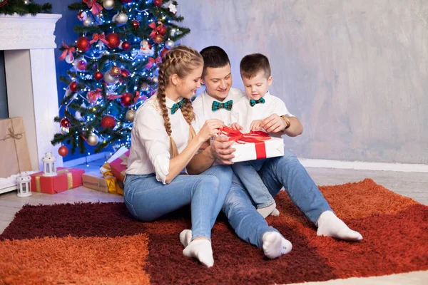 Mom dad and young son at Christmas New Year holiday gifts — Stock Photo, Image