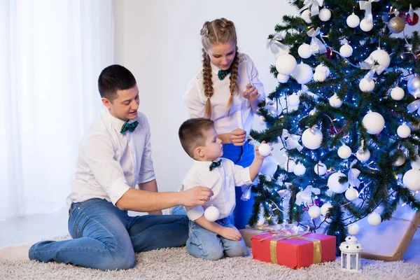Mom dad and little son Christmas decor New Year holiday gifts — Stock Photo, Image