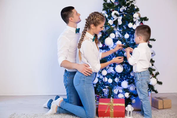 Mom dad and little son Christmas decor New Year holiday gifts — Stock Photo, Image