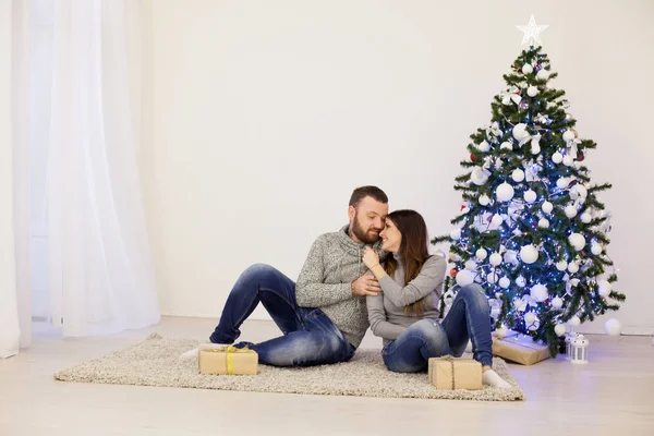 Male and female Christmas tree new year holiday gifts — Stock Photo, Image