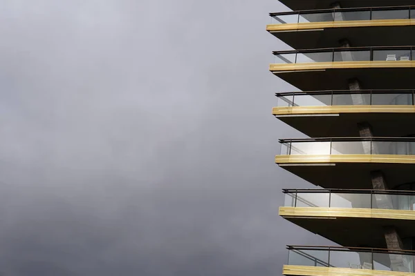 terrace building on the gray rain clouds