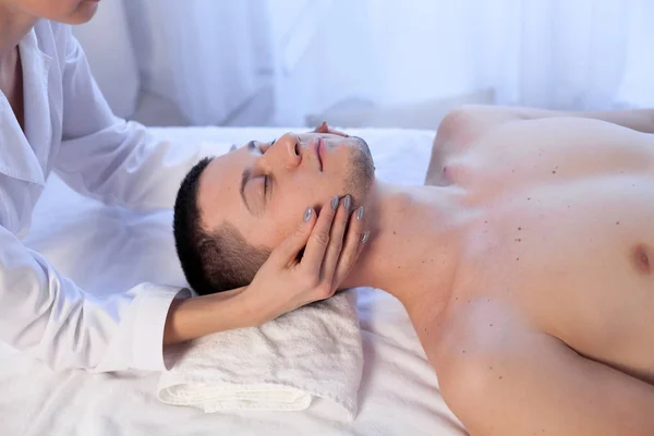 Doctor cosmetologist doing facial massage men spa treatments — Stock Photo, Image