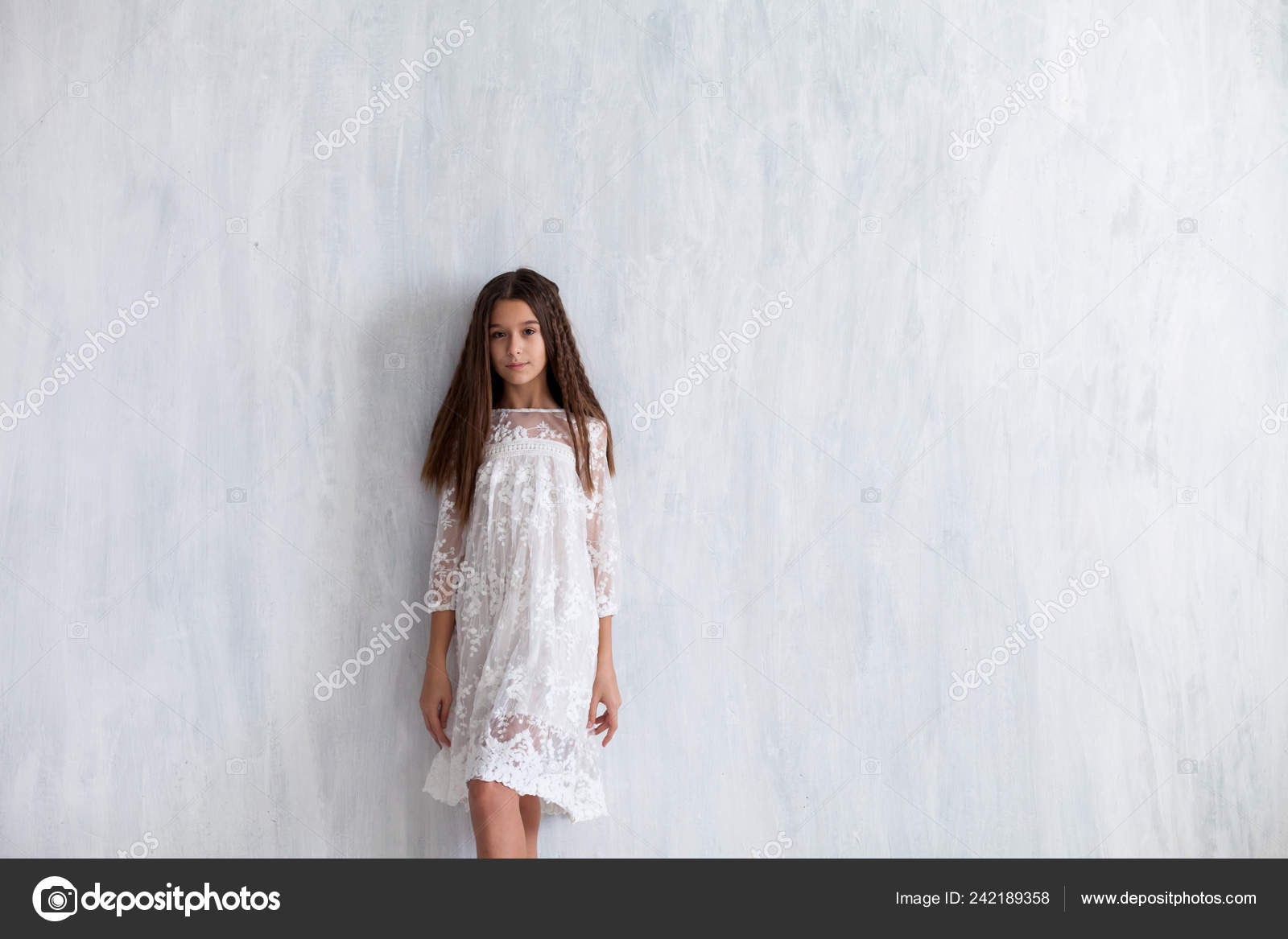 12, 13, 14 year old girl with dress on gray isolated studio background.  Elegant teenager child girl in fashion ball dress Stock Photo - Alamy