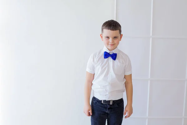 Portrait of a beautiful boy with a butterfly on a white background — Stock Photo, Image