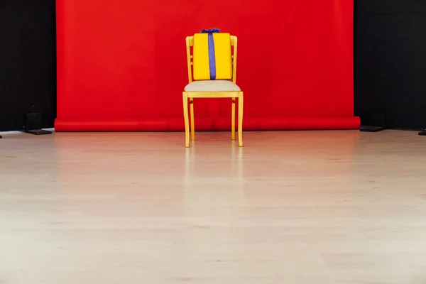 red black background room and golden chair