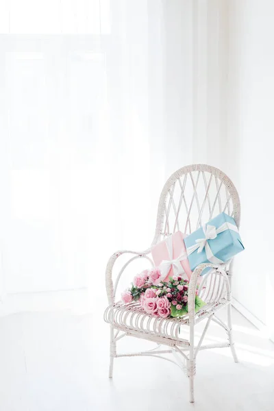 vintage chair with gifts in the interior of the white room