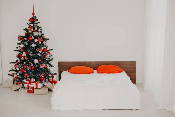 decor white bedroom with Christmas tree Christmas gifts Red