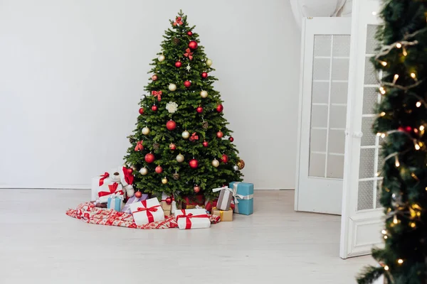 The interior of the room is a Christmas tree with red gifts for the new year decor winter holiday