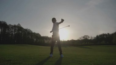 Gün batımına doğru Golf siluet Junior.