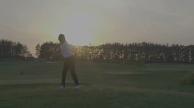 Gün batımına doğru Golf siluet Junior.