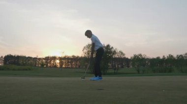 Gün batımına doğru Golf siluet Junior.