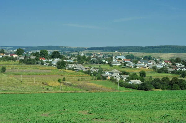 Rural landscape of Ternopil. Green tourism in Ternopil. On a summer sunny day in  nature. In warm sunny weather on nature. Under the blue sky. Sunny summer day. Private buildings in Ukrainian villages.