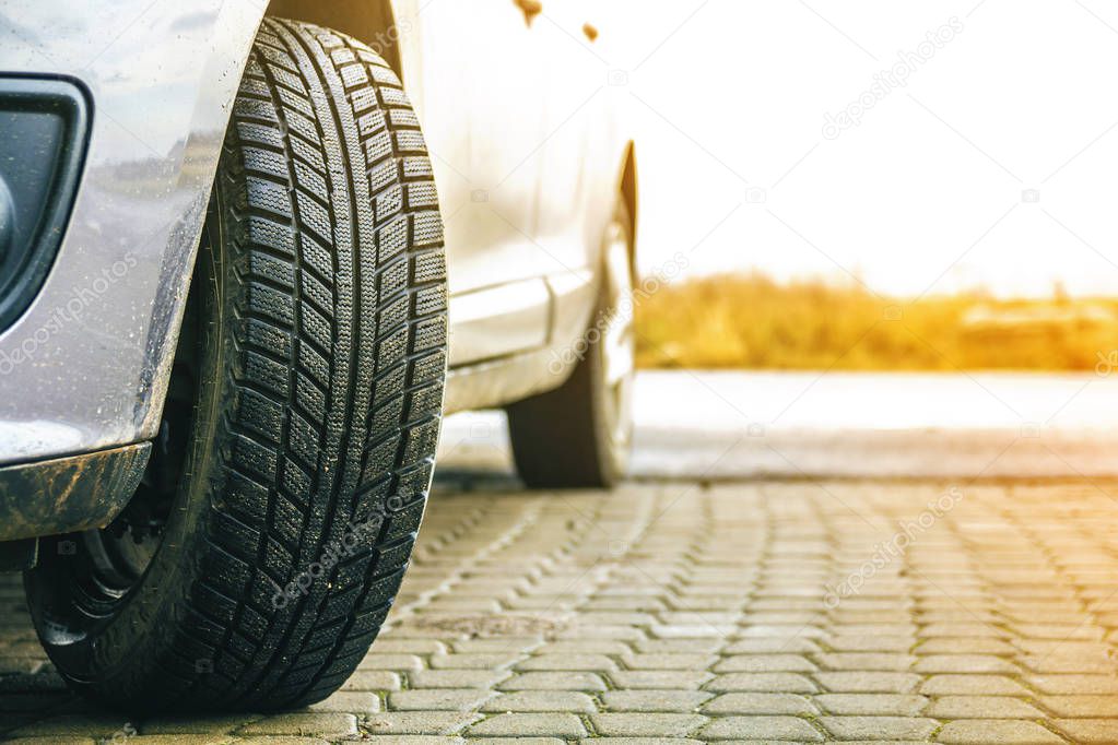 Close-up image of car wheel with black rubber tire