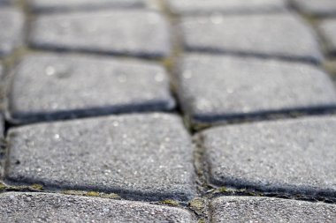 Kare içinde eski moda basit kaba gri soyut desen güneş beton sokak kaldırım taşı kaldırım tarafından yaktı. İnşaat, dekorasyon ve arka plan kavramı.