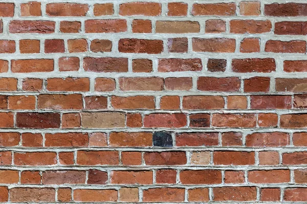 Nahaufnahme Einer Naturbelassenen Alten Verwitterten Rotbraunen Nicht Verputzten Massiven Ziegelwand — Stockfoto