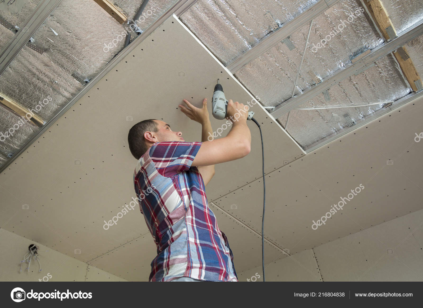 Young Man Usual Clothing Work Gloves Fixing Drywall