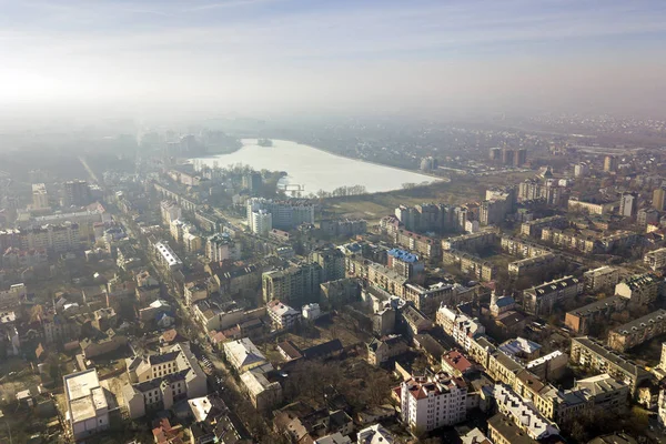 Aerial view of modern city urban foggy landscape on bright blue