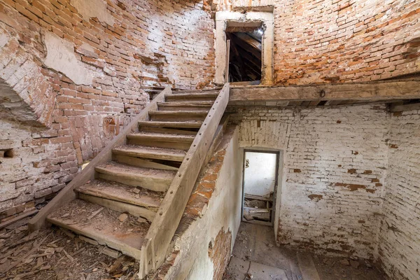 Large spacious forsaken empty basement room of ancient building Stock Photo