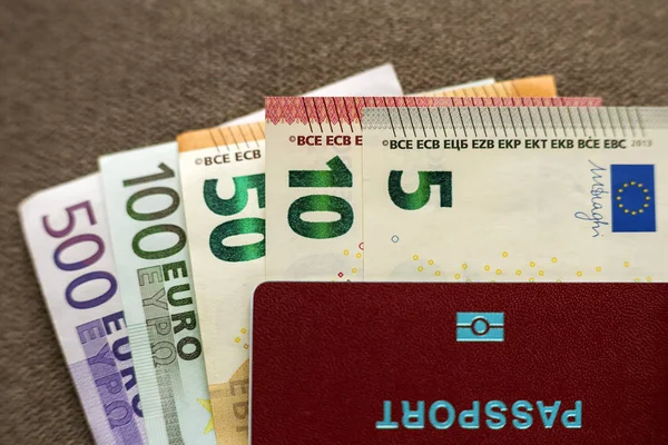 Travel passport and money, Euro banknotes bills on copy space ba