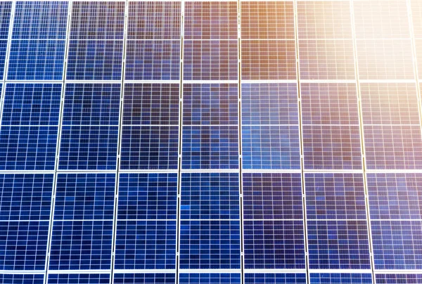 Close-up surface of lit by sun blue shiny solar photo voltaic pa