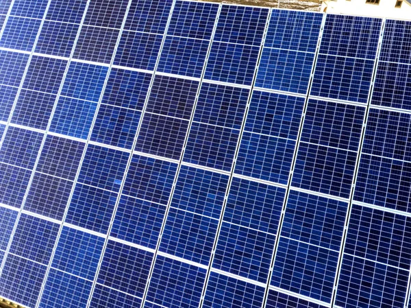 Close-up surface of lit by sun blue shiny solar photo voltaic pa — Stock Photo, Image
