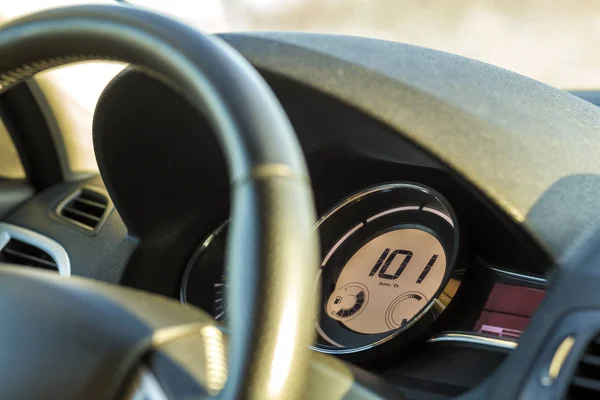 Modern car interior with driver hand on steering wheel. Safe dri — Stock Photo, Image