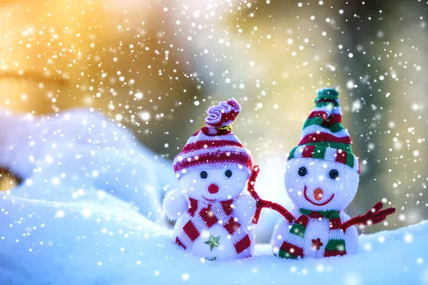 Stock image Two small funny toys baby snowman in knitted hats and scarves in